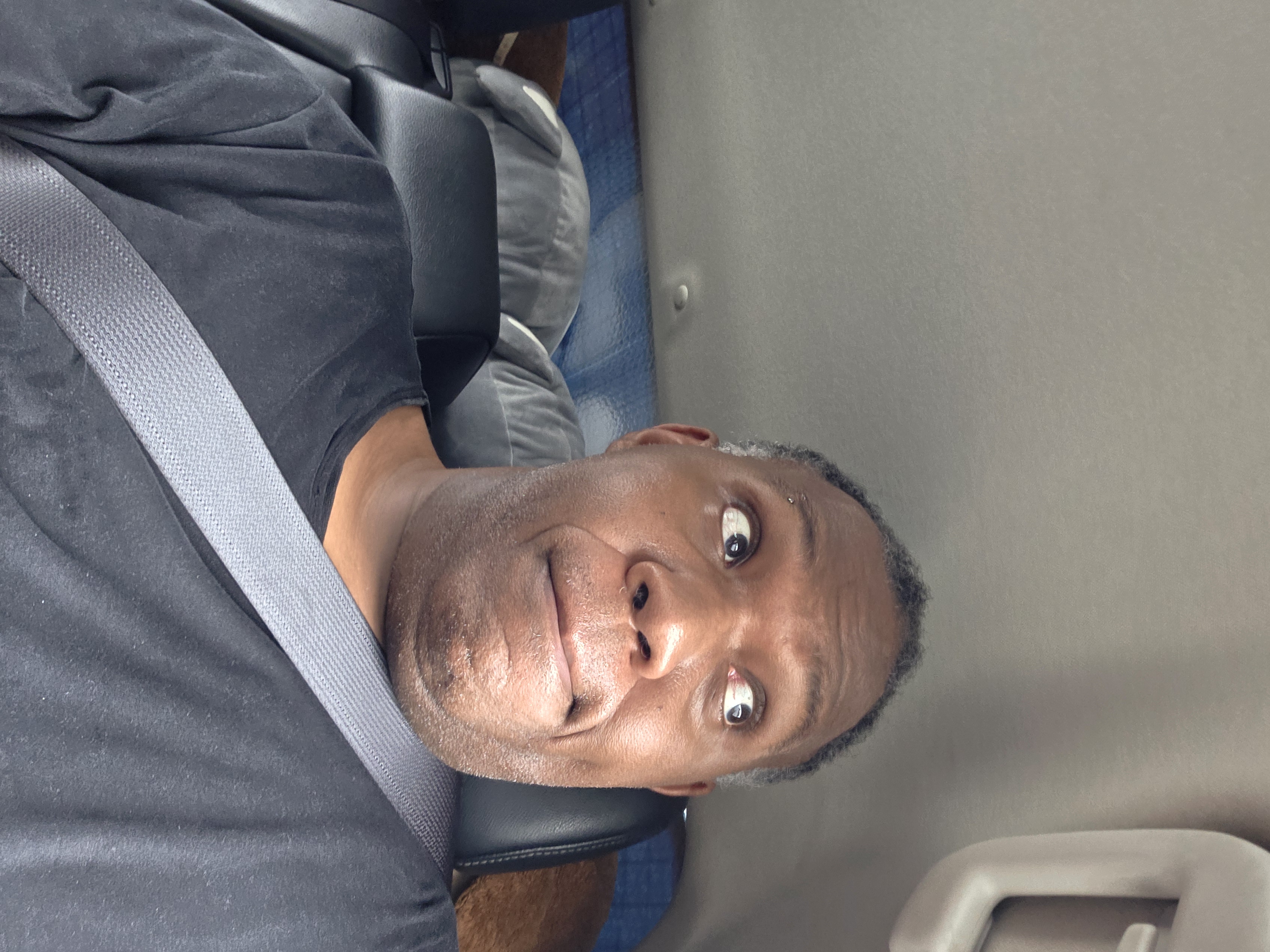 Rodney selfie in airport transfer vehicle, on arrival