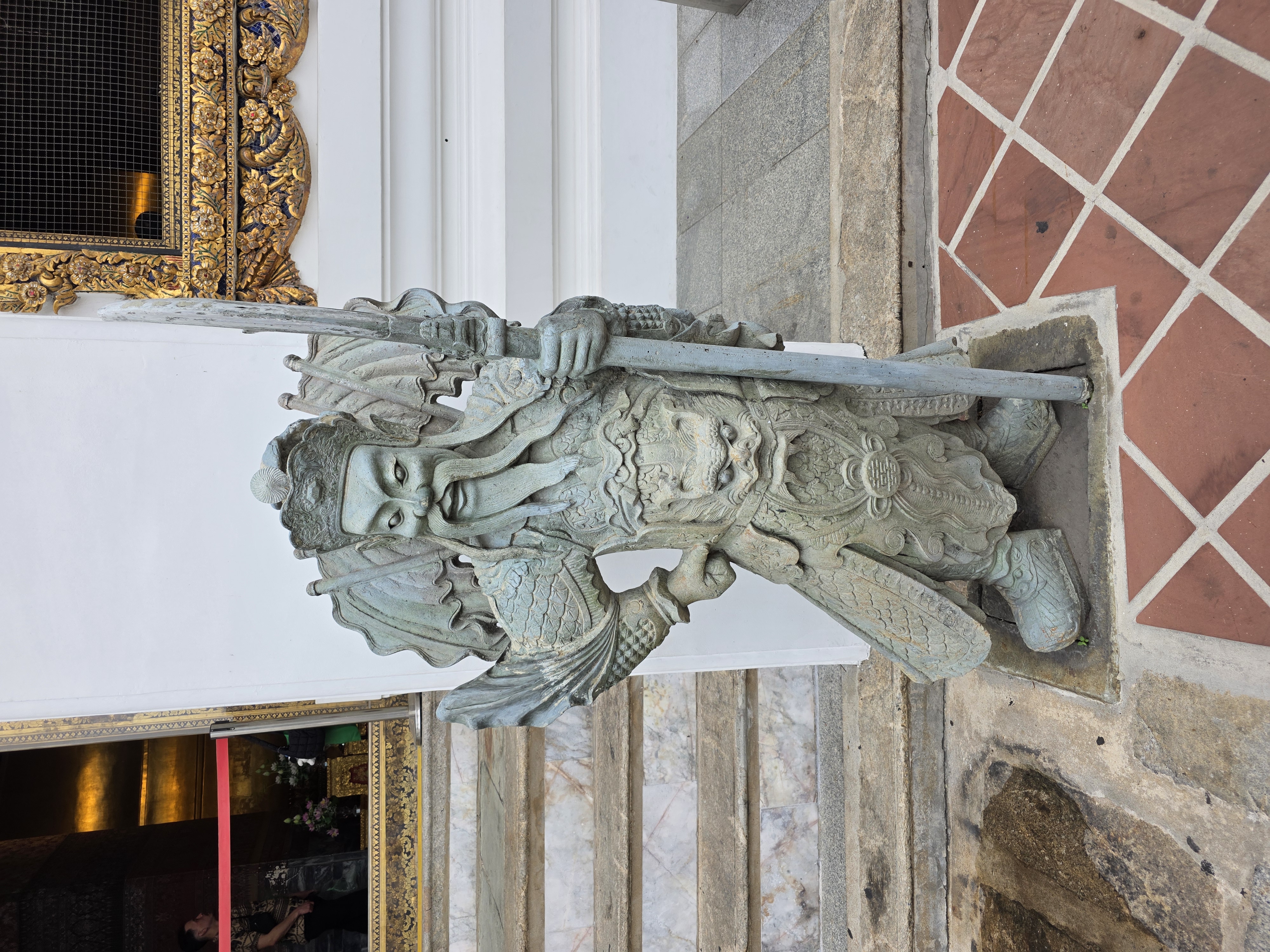 Chinese stone guardian statue at Wat Pho entrance
