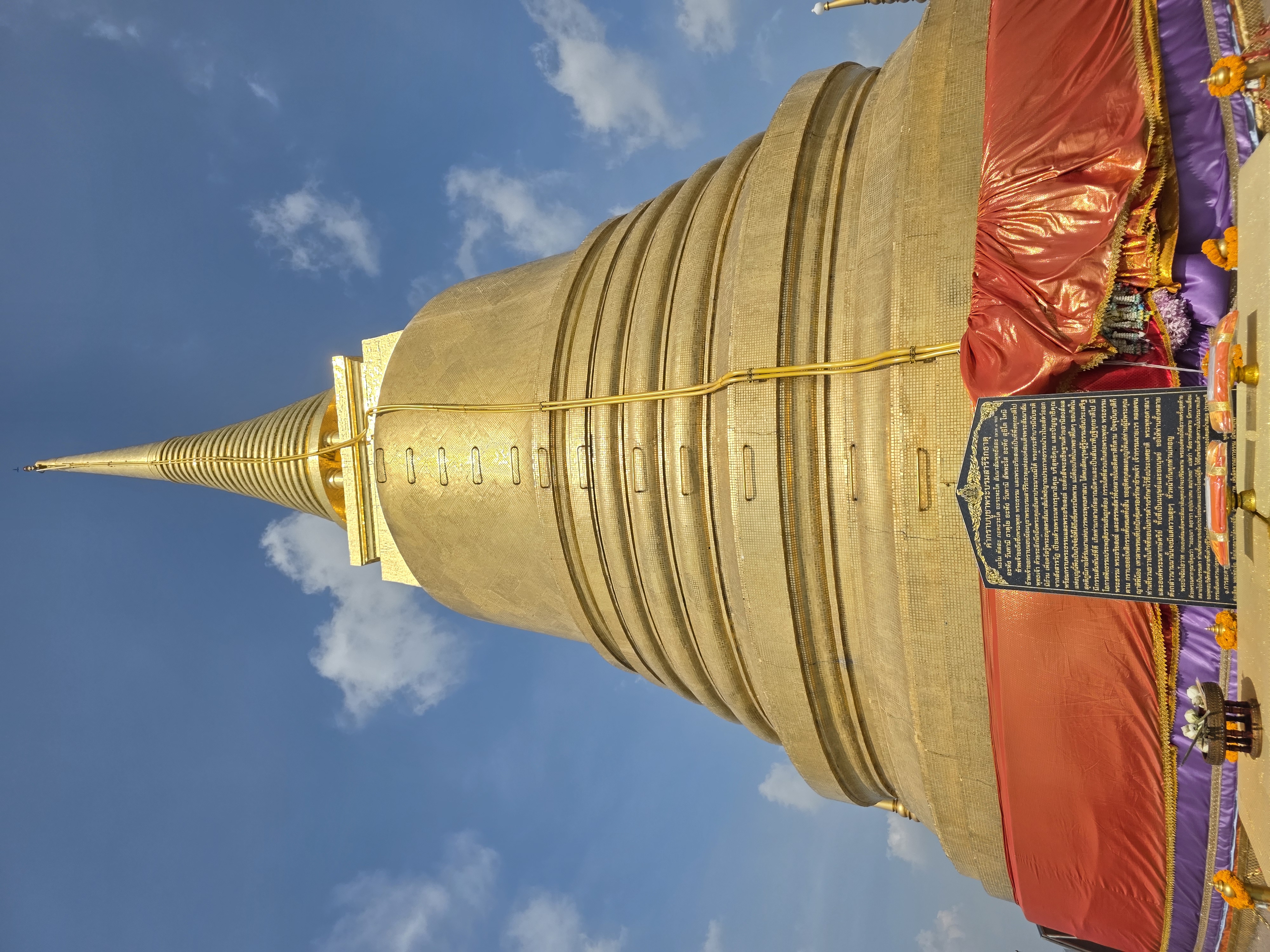 golden chedi of Wat Saket against blue sky