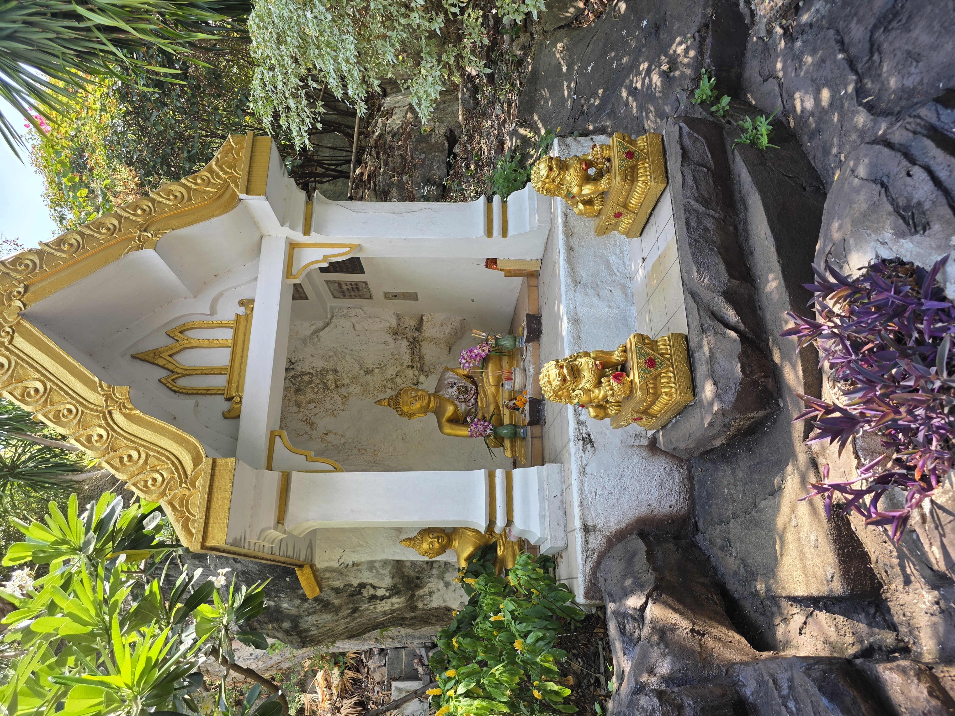 small Buddha shrine on the path up the Golden Mount