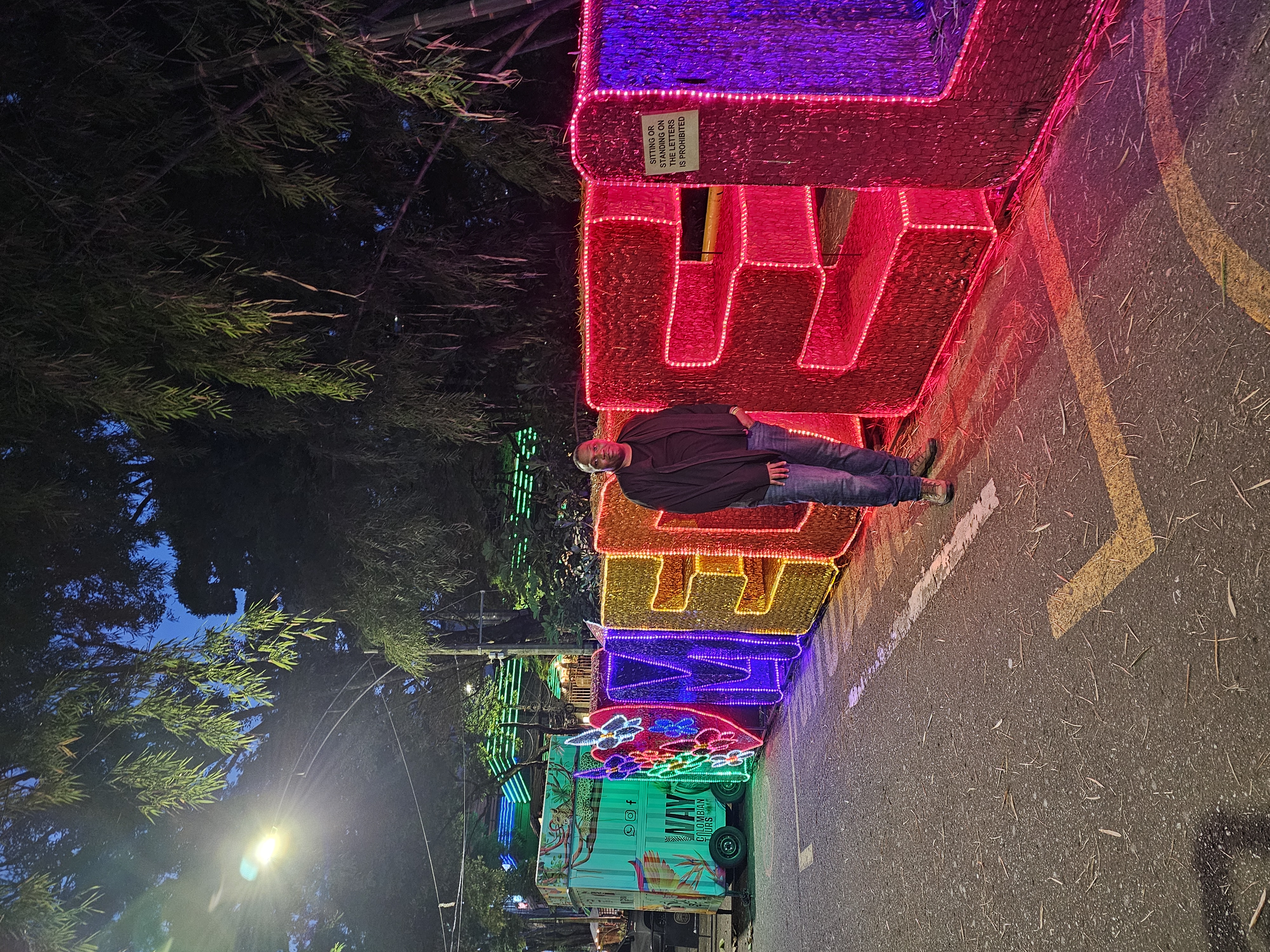 illuminated Medellín sign, night