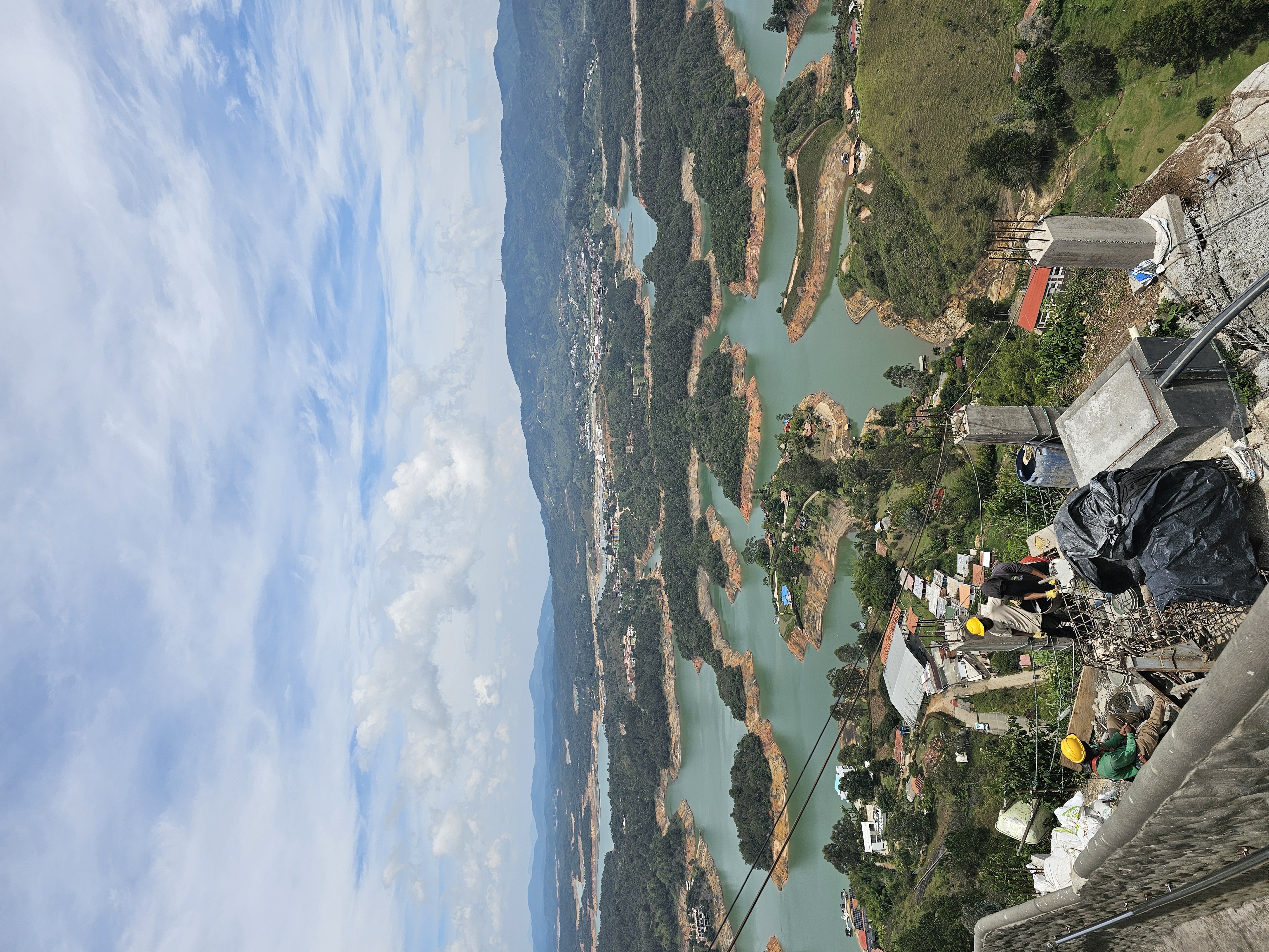 summit panorama, construction workers in frame