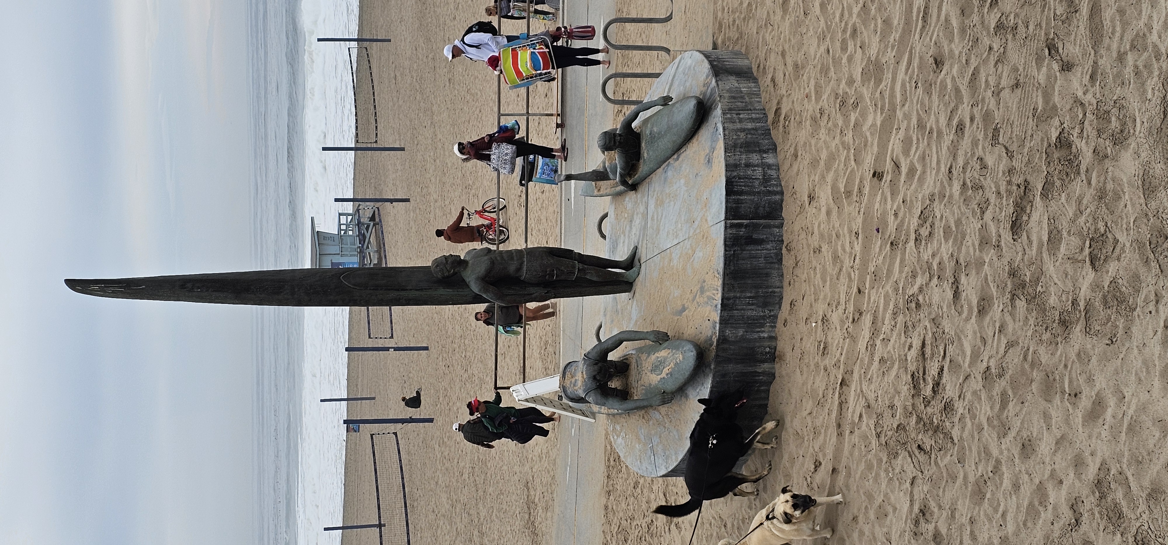 Venice Beach surfing statue, grey December sky