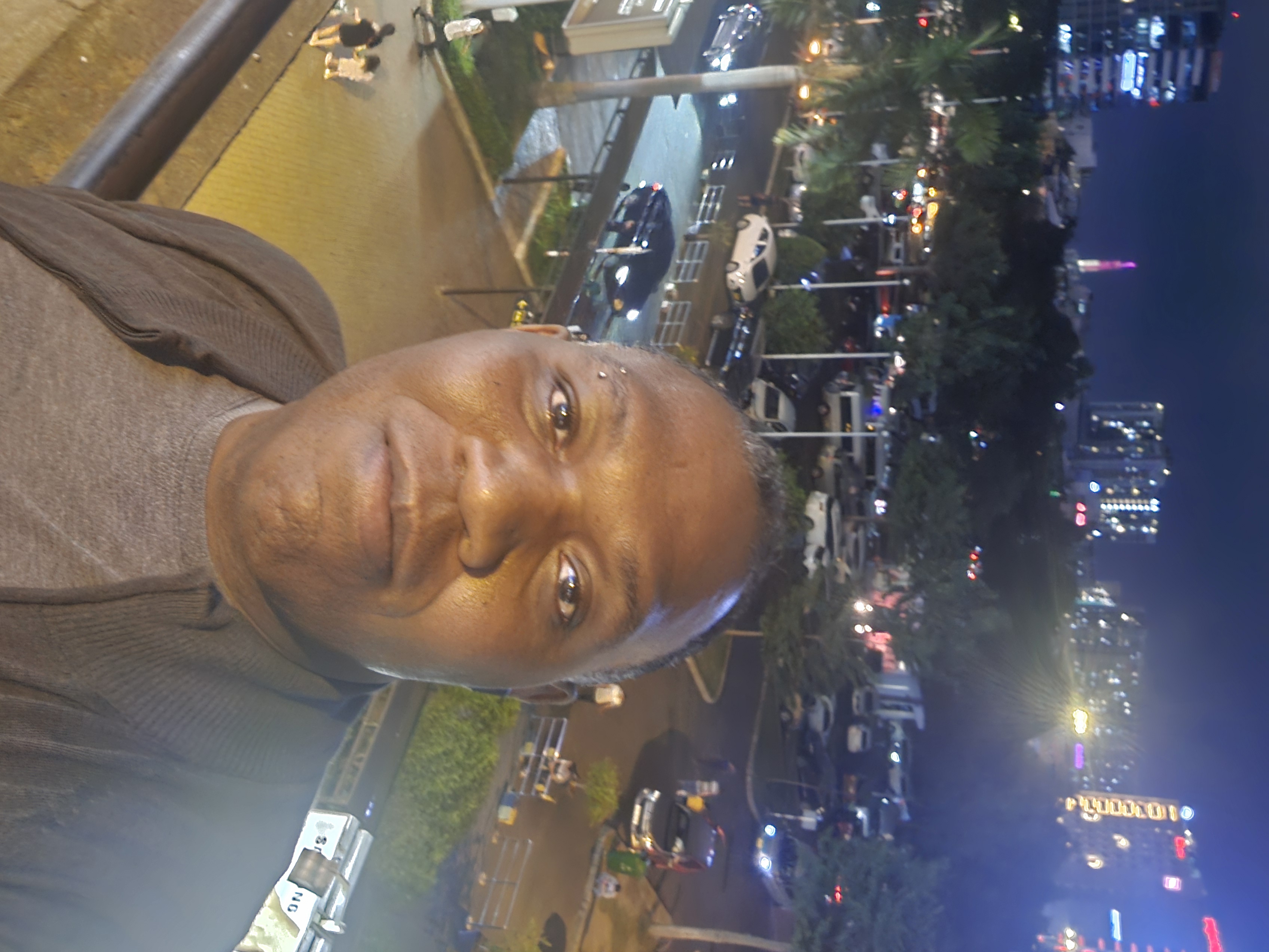 Rodney selfie at night in Ho Chi Minh City street scene