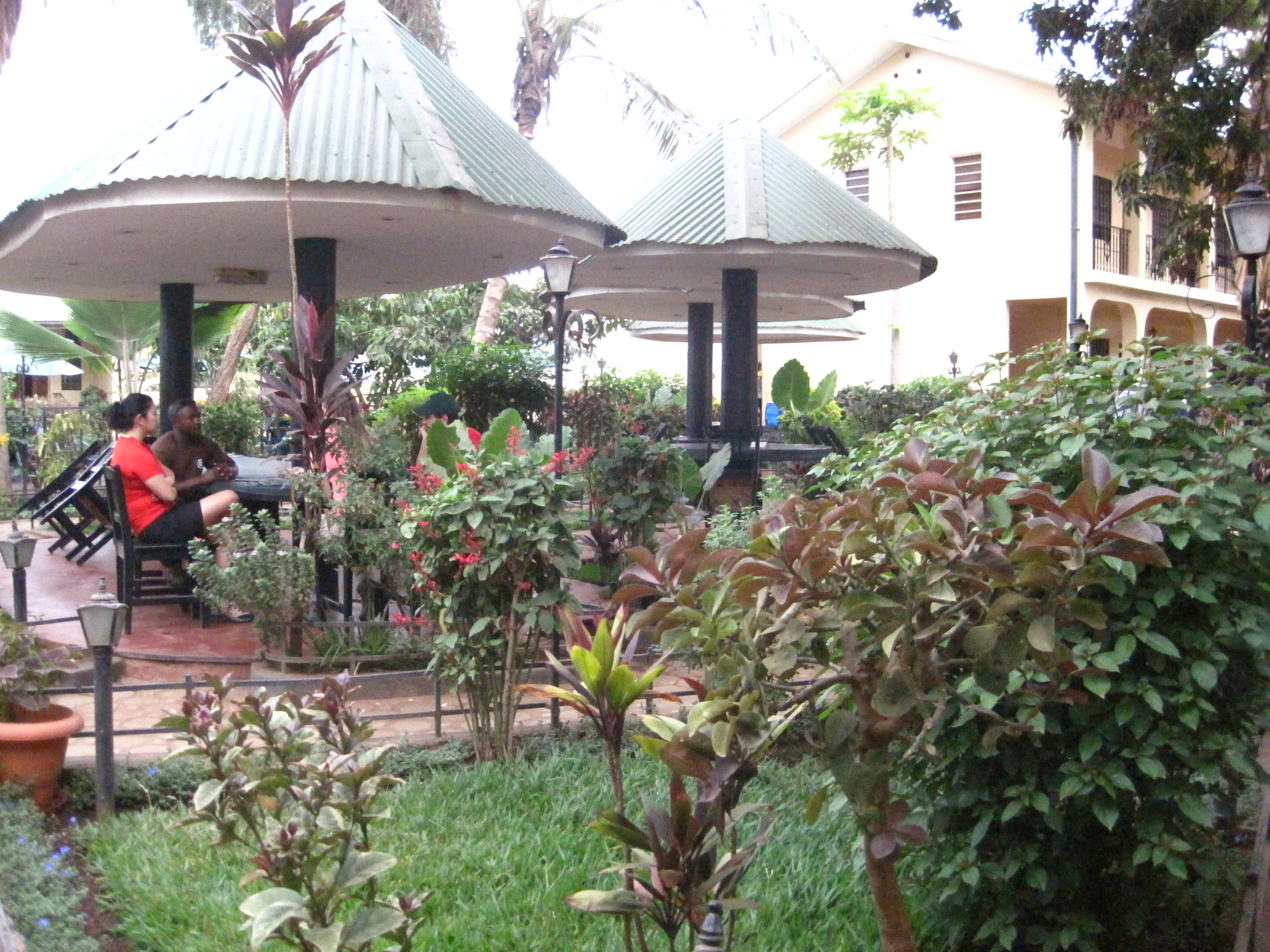 Certificate ceremony at Springlands Hotel — Ashard presenting the Gold Uhuru Peak certificates