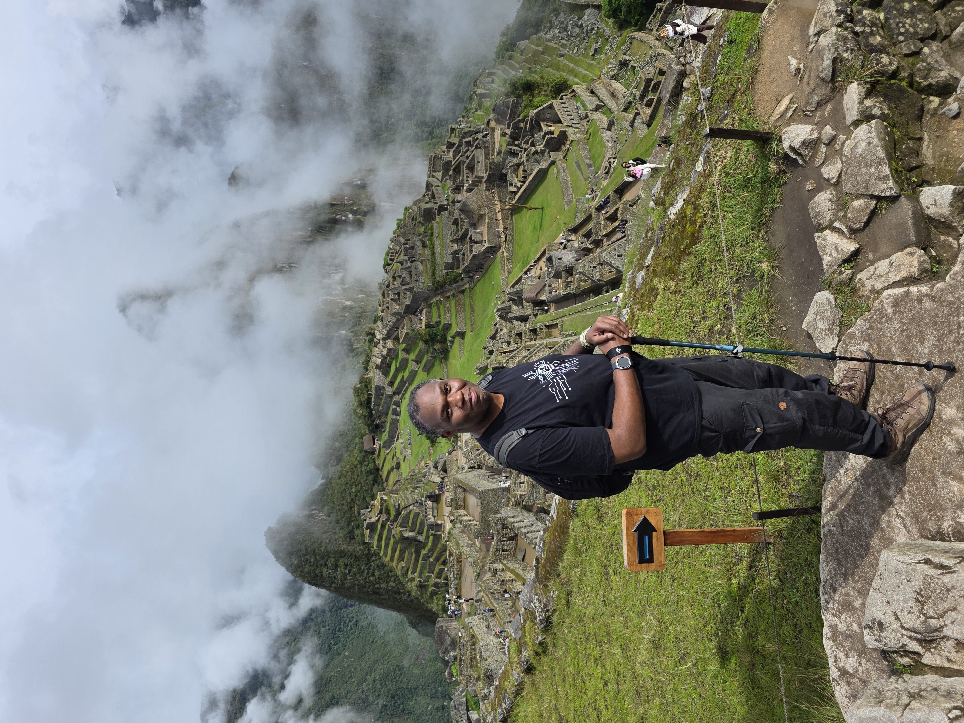 Machu Picchu overlook, Rodney + citadel + cloud over peak