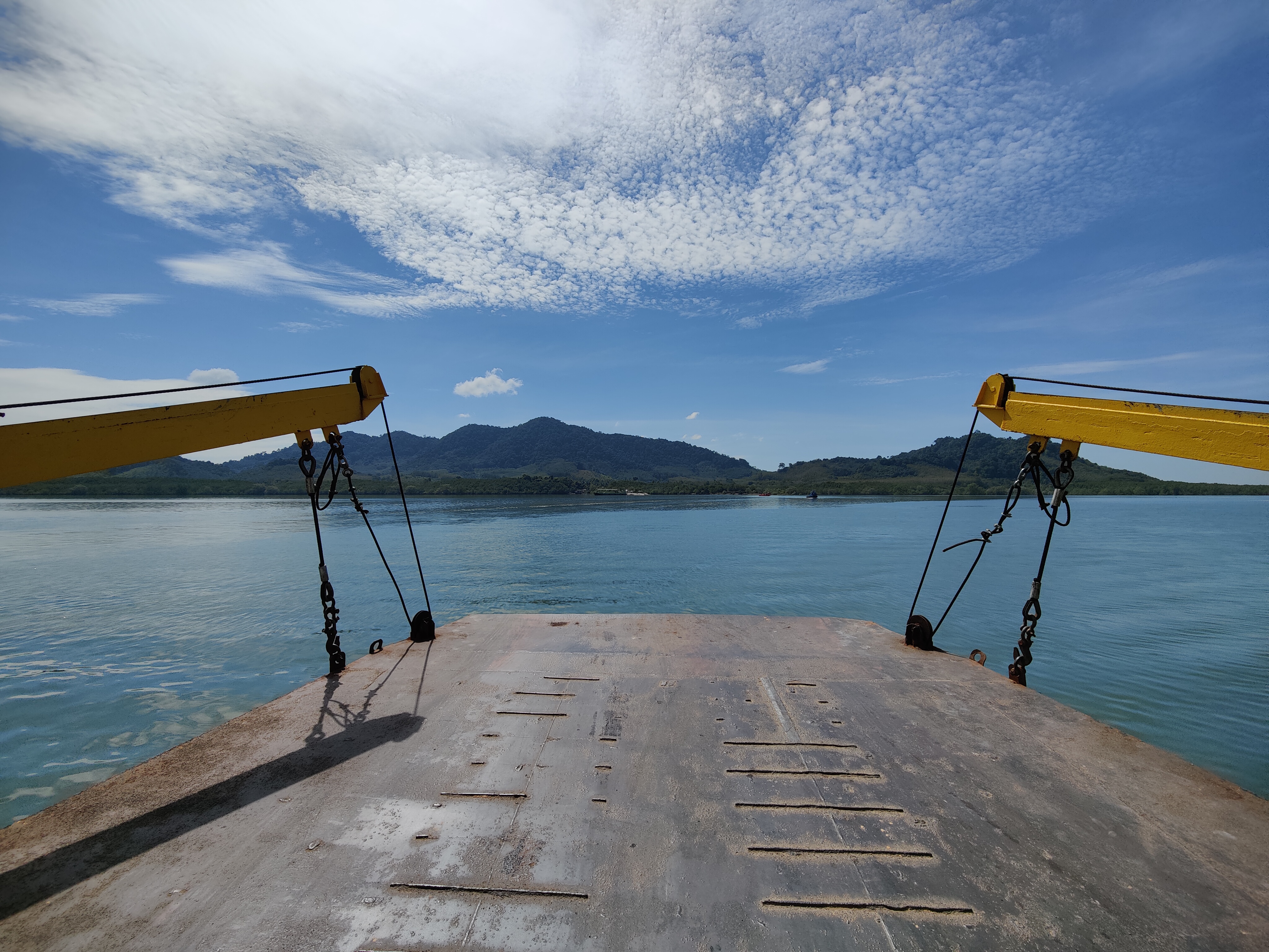 car ferry crossing to Koh Lanta, turquoise water and jungle hills