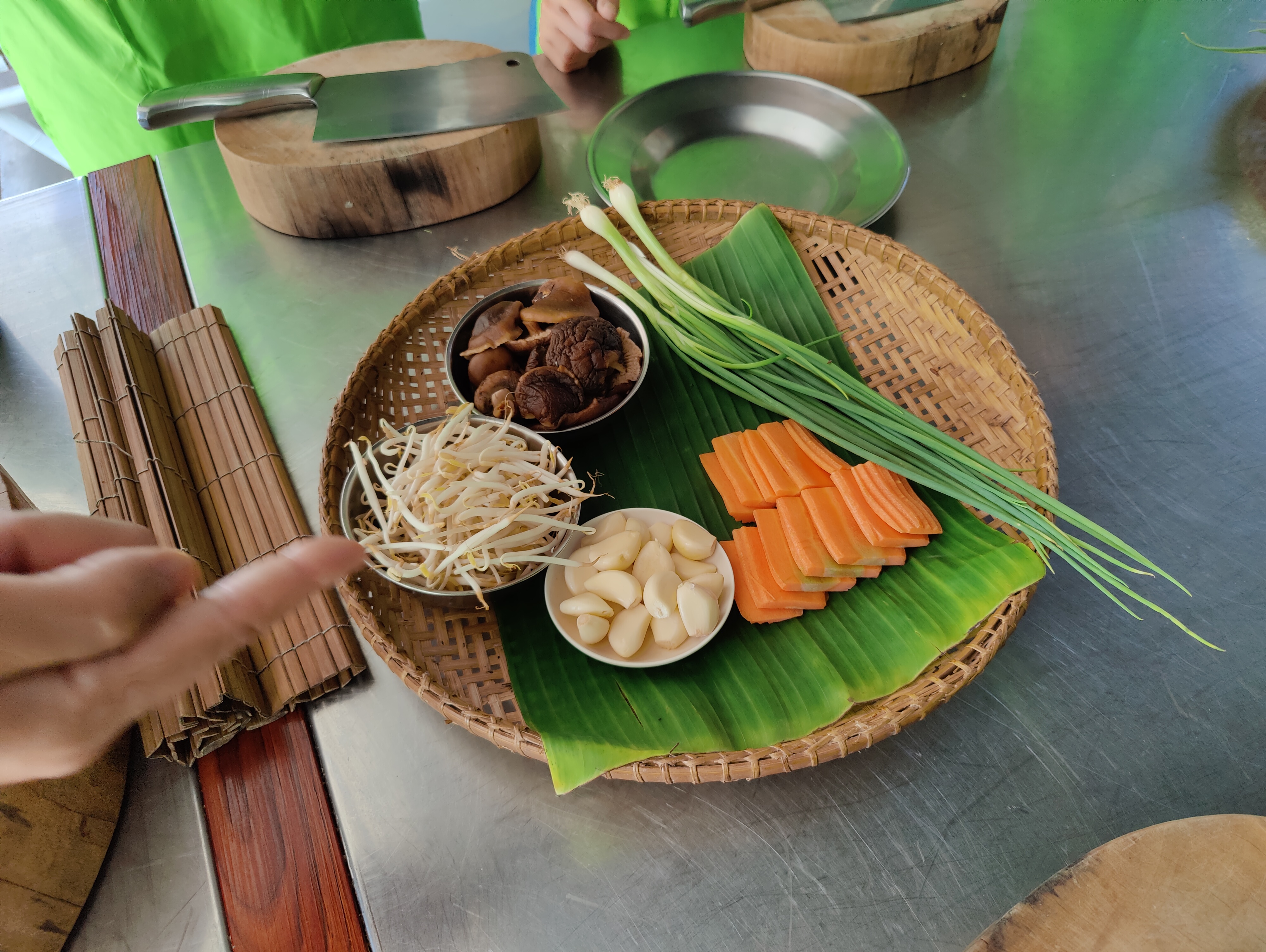 cooking class ingredients laid out on banana leaf