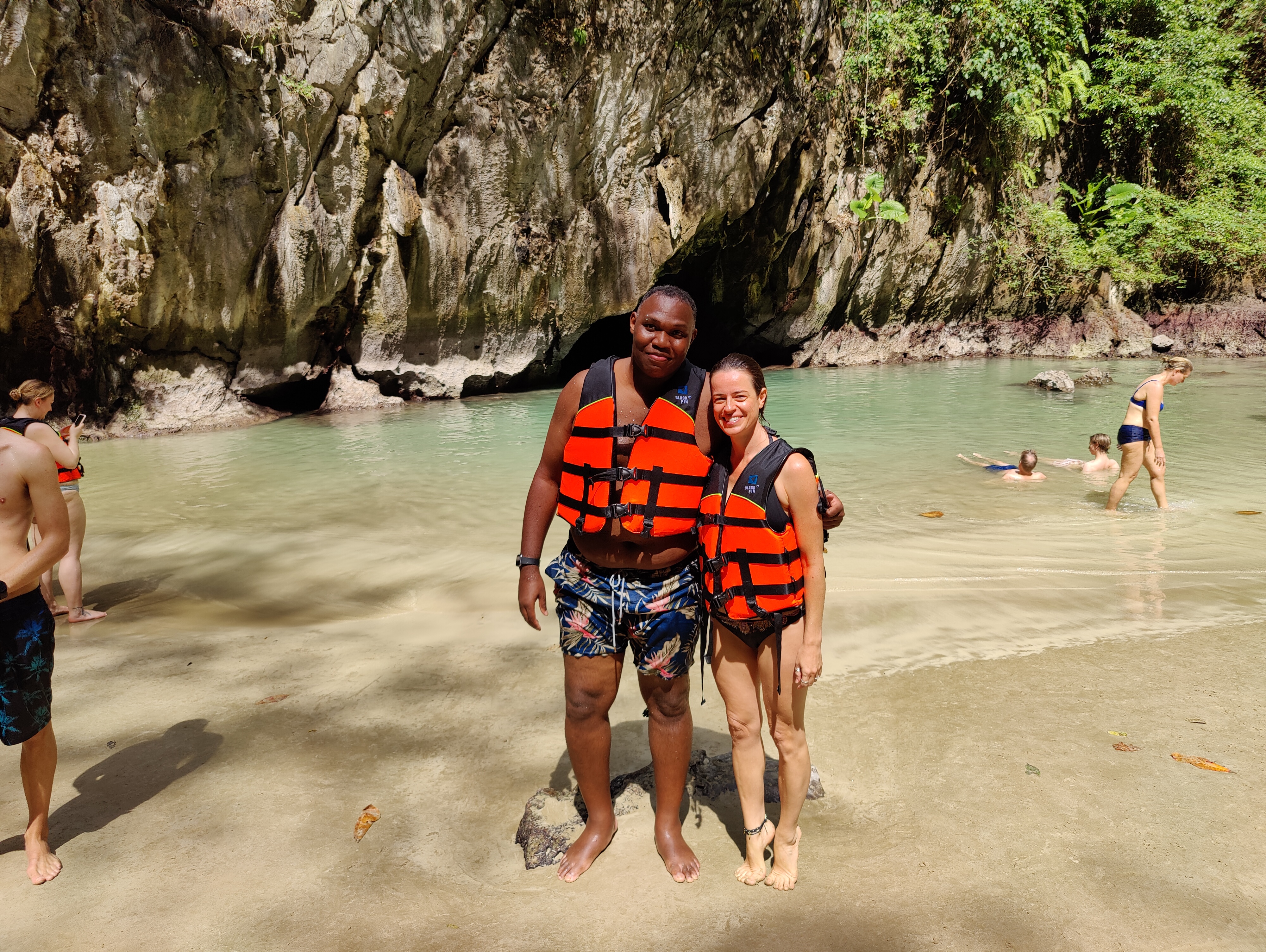 Rodney and friend in life jackets at sea cave lagoon